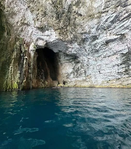 Inside the Cave of Haxhi Ali where it is shown rock formations and clear waters.